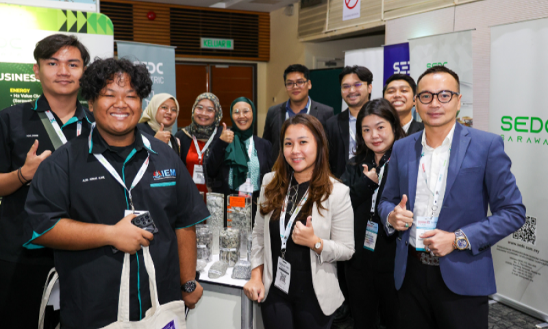 Exhibitors and visitors networking at a BuildXpo Malaysia booth